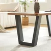 A close-up view of a table leg with a wooden tabletop. Náhled obrázku produktu