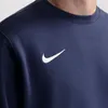 Close-up of a navy blue Nike pullover with a white Nike swoosh logo on the chest. Produktbild-Vorschau