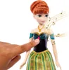 A hand is pressing the chest of a doll, with musical notes emanating from it. Náhled obrázku produktu
