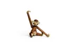 A wooden monkey toy is sitting on a white background. Anteprima dell’immagine prodotto