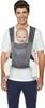 A man is wearing a baby carrier with a baby in it. Produktbild-Vorschau