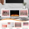 A white TV stand with an electric fireplace and LED lighting, displayed in a living room setting with decorative items and books. Voir les images du produit