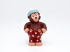 A toy monkey figurine wearing overalls and a hat, presented against a white background. Produktbild-Vorschau