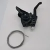 A black bicycle gear shifter with a cable is placed on a white background. Anteprima dell’immagine prodotto