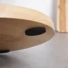 Close-up of the bottom edge of a round wooden object with black feet. Náhled obrázku produktu