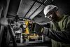 A construction worker wearing a hard hat and safety vest uses a DeWalt drill with a dust collection attachment to drill into a pipe. Anteprima dell’immagine prodotto