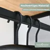 Close-up of black metal hangers on a shelf. Produktbild-Vorschau
