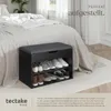 A shoe cabinet with a padded top is placed next to a bed in a bedroom. Náhled obrázku produktu