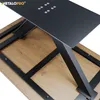 A close-up view of the underside of a table, showing the black metal V-shaped legs and the wooden tabletop. Voir les images du produit