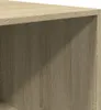A close-up view of the textured surface of a wooden furniture piece, likely a shelf or cabinet. Voir les images du produit