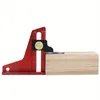 A woodworking depth gauge is shown on a plain white background, with its measuring edge resting on a wooden block. Náhled obrázku produktu