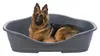 A German Shepherd dog lies in a gray plastic dog bed. Náhled obrázku produktu
