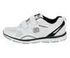 A side view of a white athletic shoe with black accents and velcro straps. Produktbild-Vorschau