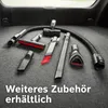 Various vacuum cleaner attachments laid out on a carpeted surface. Produktbild-Vorschau
