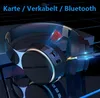 A close-up, angled view of a pair of black over-ear Bluetooth headphones with blue light accents, set against a dark, reflective background. Produktbild-Vorschau