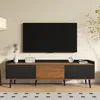 A modern TV stand with a television mounted above it, set in a living room environment. Produktbild-Vorschau