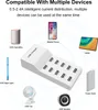 A white USB charging station is shown with various USB-powered devices around it, illustrating its compatibility. Náhled obrázku produktu