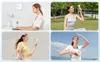 A collage of four images showing a woman using a portable fan in various settings: at a desk, outdoors while doing yoga, outdoors with a light yellow outfit, and outdoors against a blue sky. Anteprima dell’immagine prodotto
