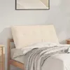 A beige headboard pillow is placed on a bed with a wooden bed frame. Anteprima dell’immagine prodotto