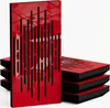 A stack of red acoustic panels with black cutouts, with one panel standing upright in the foreground. Produktbild-Vorschau