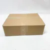 A brown cardboard box is shown against a white background. Produktbild-Vorschau