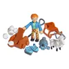 A collection of toys including a figure, a sled, a snowball launcher, a sheep, and winter accessories, arranged on a white background. Produktbild-Vorschau