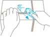 Hands using a safety cutter to cut tape on a box at a 45-degree angle. Produktbild-Vorschau