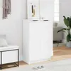 A white shoe cabinet in a hallway with a bench and a plant. Náhľad obrázku produktu