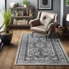 A living room scene with a chair, bookshelf, and rug. Produktbild-Vorschau