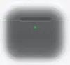 A close-up of a white charging case for wireless earbuds, with a small green indicator light on the front. Náhľad obrázku produktu
