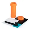 An orange container, its cap, and some accessories are arranged on a white background. Náhľad obrázku produktu