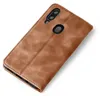A brown leather flip case for a smartphone, shown from a diagonal angle. Produktbild-Vorschau
