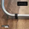 A close-up of a silver metal drying rack with black rubber feet on a wooden floor. Produktbild-Vorschau