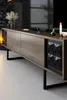 A modern living room with a TV stand, TV, and decorative items. Anteprima dell’immagine prodotto