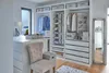 A well-organized walk-in closet with storage solutions. Anteprima dell’immagine prodotto