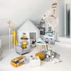 A child's playroom with a tent, small table and chairs, and various toys. Voir les images du produit