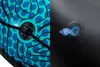 A close-up view of two distinct sections of an inflatable product, likely a swimming ring. The left side shows a patterned surface with blue circles and black lines on a teal background, featuring a black rope threaded through a circular grommet. The right Anteprima dell’immagine prodotto