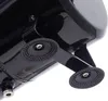 A close-up view of the underside of a black airbrush compressor, showing its feet. Podgląd zdjęcia produktu