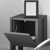 A gray nightstand with its door open, revealing the interior. An e-reader is placed on top of the nightstand. Anteprima dell’immagine prodotto