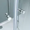 Close-up view of a shower cabin with chrome handles and glass doors. Produktbild-Vorschau