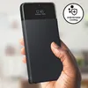 A hand holding a black smartphone with a flip cover. Produktbild-Vorschau