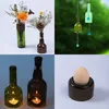 A collage of four images showing different DIY projects made from glass bottles. Produktbild-Vorschau