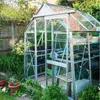 A greenhouse filled with plants and gardening supplies. Náhľad obrázku produktu