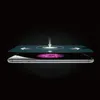 A screen protector is shown being applied to a smartphone. Voir les images du produit