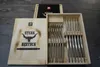 A wooden box containing a set of steak cutlery, with a lid open to reveal the contents. Produktbild-Vorschau