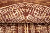 A close-up view of a rolled-up rug with a detailed pattern. Anteprima dell’immagine prodotto