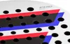 A close-up view of a white padel racket with red and blue stripes and black holes. Produktbild-Vorschau