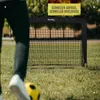 A person is about to kick a soccer ball towards a soccer goal set up on a grassy field. Produktbild-Vorschau