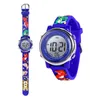A digital watch with a blue strap decorated with cartoon dinosaurs and a castle, shown from two angles. Produktbild-Vorschau