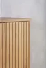 Close-up of a wooden cabinet with vertical slats. Podgląd zdjęcia produktu